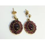 A Pair of Carbuncle Garnet earrings in 9ct yellow gold,
