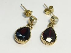 A pair of pear drop shape Garnet pendant Earrings, set in 9ct gold.