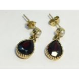 A pair of pear drop shape Garnet pendant Earrings, set in 9ct gold.