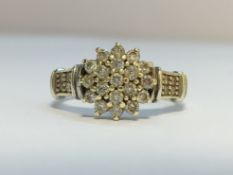 A Diamond Floral Cluster ring in 9ct white gold. Diamonds 0.50 ct stamped in band.