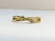 A Double band Diamond Crossover ring in 9ct yellow gold. Diamonds ETCW 0.05 ct.