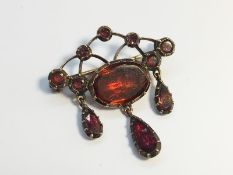 A Georgian Flat cut Garnet Girandole Brooch in 9ct Rose Gold.