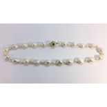 Fireball baroque pearl necklace, approximately 22” in length.