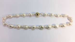 Fireball baroque pearl necklace, approximately 22” in length.