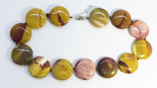 An Agate Necklace, formed as disc shaped beads of 30mm diameter, sterling silver fittings.
