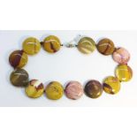 An Agate Necklace, formed as disc shaped beads of 30mm diameter, sterling silver fittings.