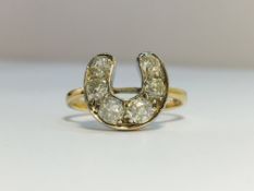 A Diamond Horseshoe ring, set in 18 ct gold. The six old cut diamonds have an ETCW of 1.1 ct.