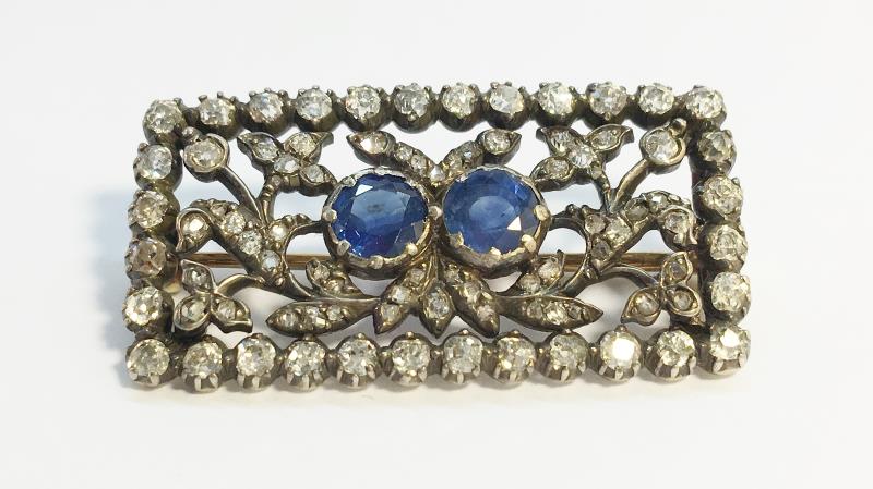 A nineteenth century Sapphire and Diamond oblong brooch, set with two round Ceylon blue sapphires,