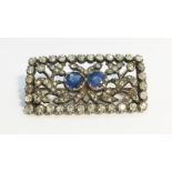 A nineteenth century Sapphire and Diamond oblong brooch, set with two round Ceylon blue sapphires,