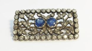 A nineteenth century Sapphire and Diamond oblong brooch, set with two round Ceylon blue sapphires,