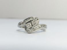 A Diamond Crossover Ring set in 18ct white gold. ETCW of brilliant cut diamonds 0.