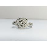 A Diamond Crossover Ring set in 18ct white gold. ETCW of brilliant cut diamonds 0.