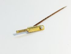 A cased Tie pin fashioned as a cricket bat with 18ct gold head, set with a seed pearl.