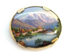 A Continental oval enamelled brooch set in 9ct yellow gold frame,