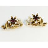 A pair of 1950’s garnet and pearl earrings, fashioned as floral sprays, set in 9ct yellow gold.