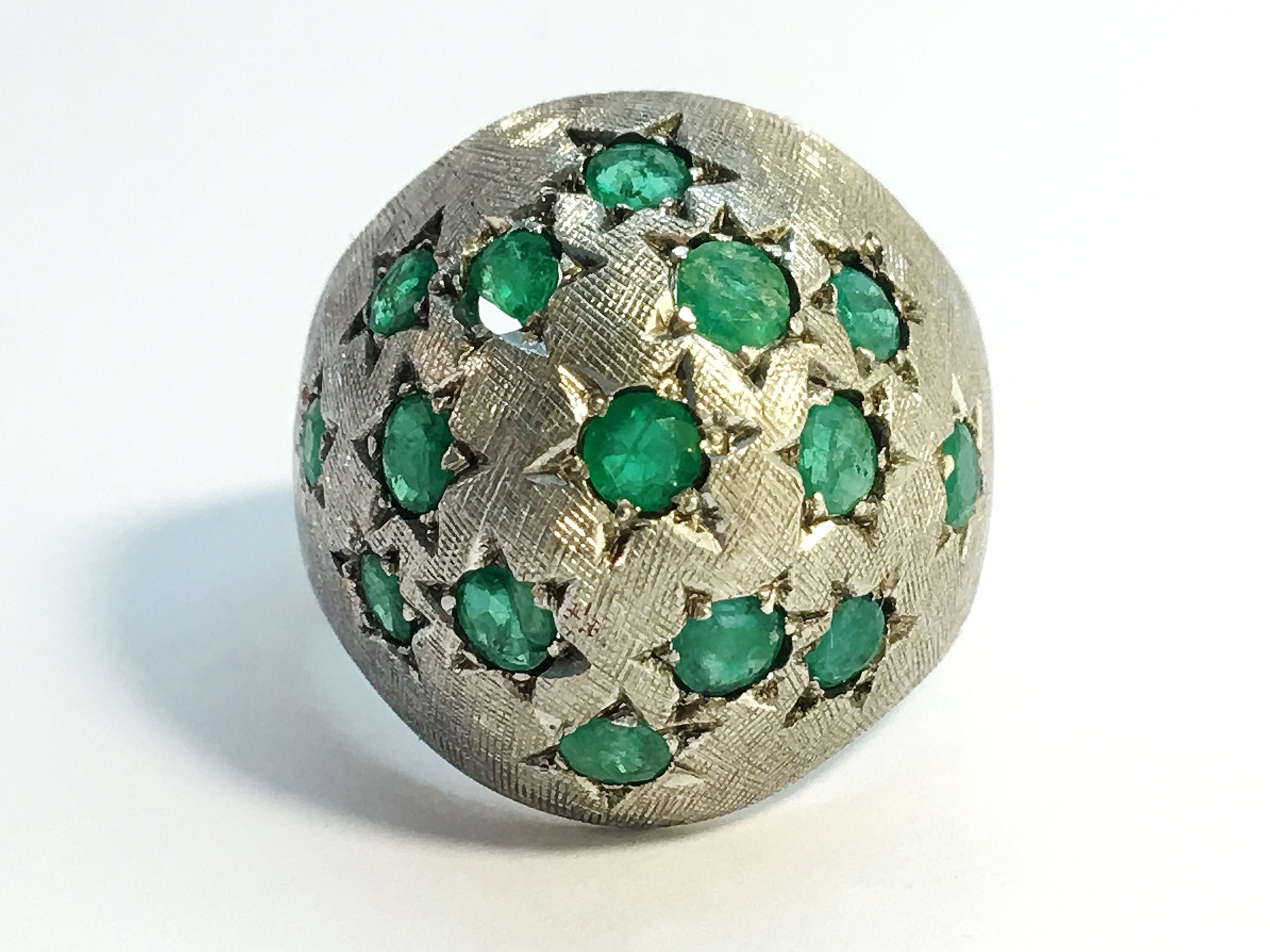 A 1970s emerald bombe ring in 18ct white gold. Set with 15 emeralds in star settings, ETCW 1.12 ct. - Image 8 of 8