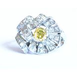 A Vintage Yellow Diamond Cluster Ring set centrally with a 0.