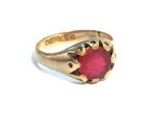 A gentlemans 1970s 9ct gold ring set with a red stone. Ring size S, total weight 5.5 grams.