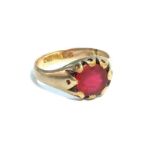 A gentlemans 1970s 9ct gold ring set with a red stone. Ring size S, total weight 5.5 grams.