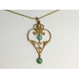 An Art Nouveau Openwork Pendant set in 15ct gold with turquoise.