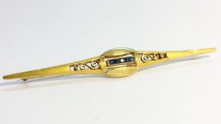 An art Deco brooch set with calbre cut sapphires and old cut diamonds in 18 ct yellow gold.