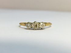 An Edwardian Diamond three stone Trilogy ring, set in 18 ct yellow gold with Platinum top.