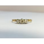 An Edwardian Diamond three stone Trilogy ring, set in 18 ct yellow gold with Platinum top.