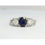 A Sapphire and Diamond Trilogy Three Stone Ring set in 18 carat gold. Oval cut sapphire ECW 0.