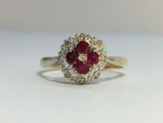 An Ruby and Diamond cluster ring in 18ct yellow and white gold. Rubies ETCW 0.