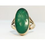 An Antique Intaglio Ring, with a Centurians head carved in green agate set in 9ct gold. Ring size O.