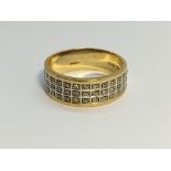 A Diamond Band Ring in 9ct yellow gold. Diamonds 0.20 ct stamped in band.