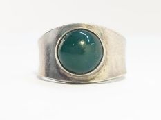 An early Georg Jenson Ring, bezel set with a green agate. Sterling Silver. Number 124.