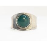 An early Georg Jenson Ring, bezel set with a green agate. Sterling Silver. Number 124.
