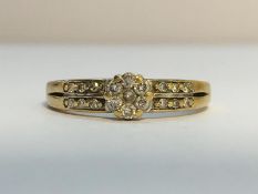 A Diamond Cluster ring set in 9ct yellow gold, ETCE 0.13 ct. Ring size M, total weight 1.89 grams.