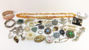 A Quantity of Vintage Jewellery including an amber nugget bead necklace and a silver charm bracelet.