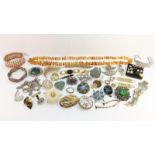 A Quantity of Vintage Jewellery including an amber nugget bead necklace and a silver charm bracelet.