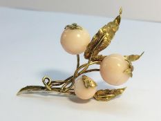 A Vintage Spray brooch, tests as gold, with pink shell beads fashioned as berries. Total weight 11.