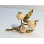 A Vintage Spray brooch, tests as gold, with pink shell beads fashioned as berries. Total weight 11.