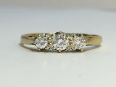 A three stone Diamond ring in 9ct yellow gold. . The ECW of the diamond is 0.