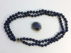 A Lapis Lazuli bead necklace, measuring 36" in length, The beads measure approximately 8mm diameter.