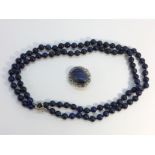 A Lapis Lazuli bead necklace, measuring 36" in length, The beads measure approximately 8mm diameter.