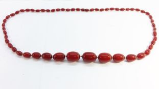 An Art Deco Cherry Amber Necklace, 76g.