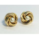 A pair of cultured pearl ear studs set in 9ct yellow gold with ropetwist border.