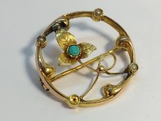 An Art Nouveau Openwork Brooch set in 15ct gold with seed pearls and turquoise. Floral design.