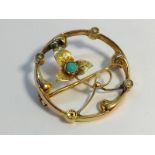 An Art Nouveau Openwork Brooch set in 15ct gold with seed pearls and turquoise. Floral design.