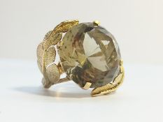 A Smoky Quartz Cocktail ring set in 14 ct gold, fashioned as textured leaves.