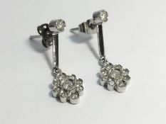 A Pair of Diamond Pendant Earrings, in 18ct white gold.