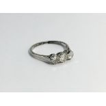 An Edwardian old cut three stone Diamond trilogy ring in 18ct white gold, platinum set. ETCW 0.