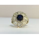 A Vintage Sapphire and Diamond cluster ring in 18ct Yellow Gold.