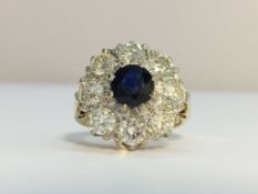 A Vintage Sapphire and Diamond cluster ring in 18ct Yellow Gold.